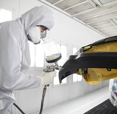 Collision Center Technician Painting a Vehicle | Priority Toyota Chesapeake in Chesapeake VA
