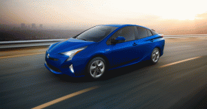 Toyota Prius driving on the highway outside the city