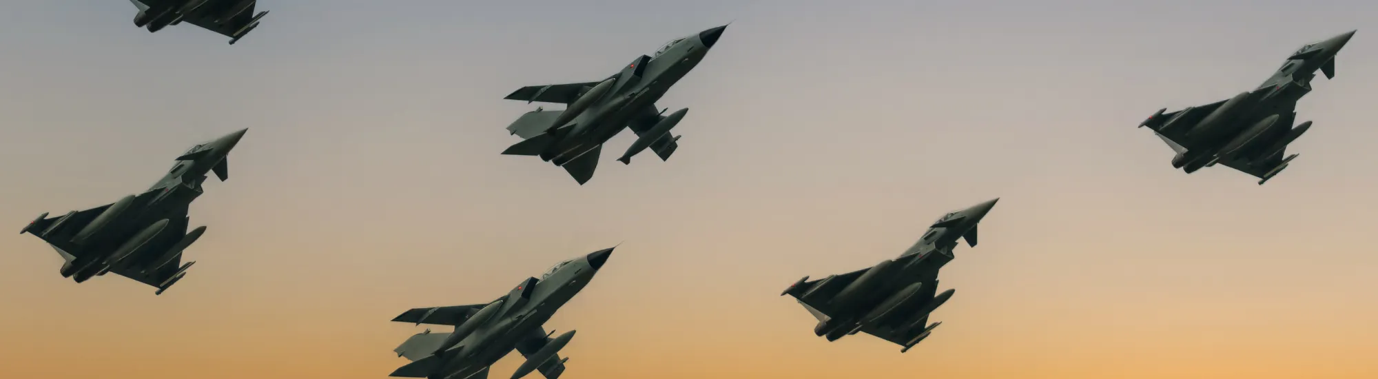 Air Force Planes flying in formation at sunset