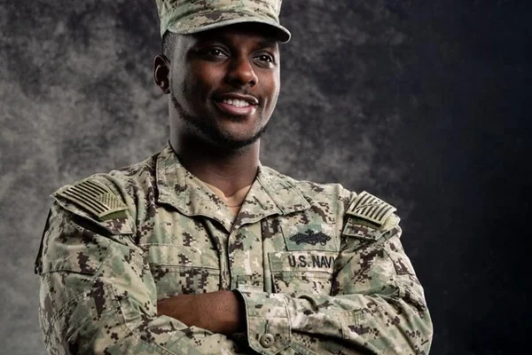 Male African American Navy Soldier in Uniform Crossing His Arms and Smiling